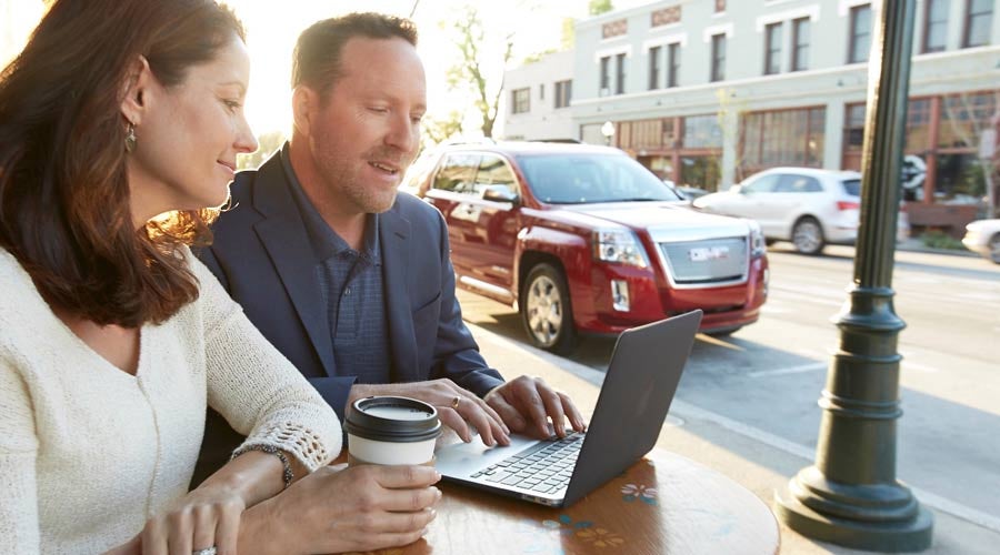 image of a man and a woman on laptop