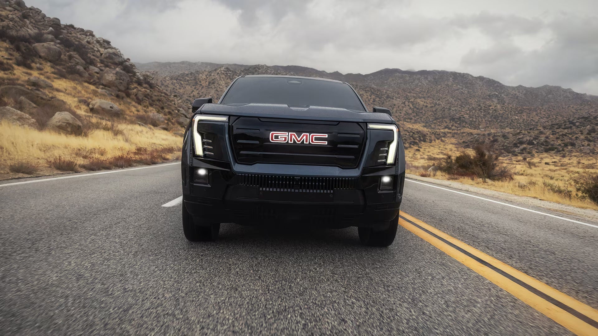 2026 GMC Sierra EV at driving on the highway